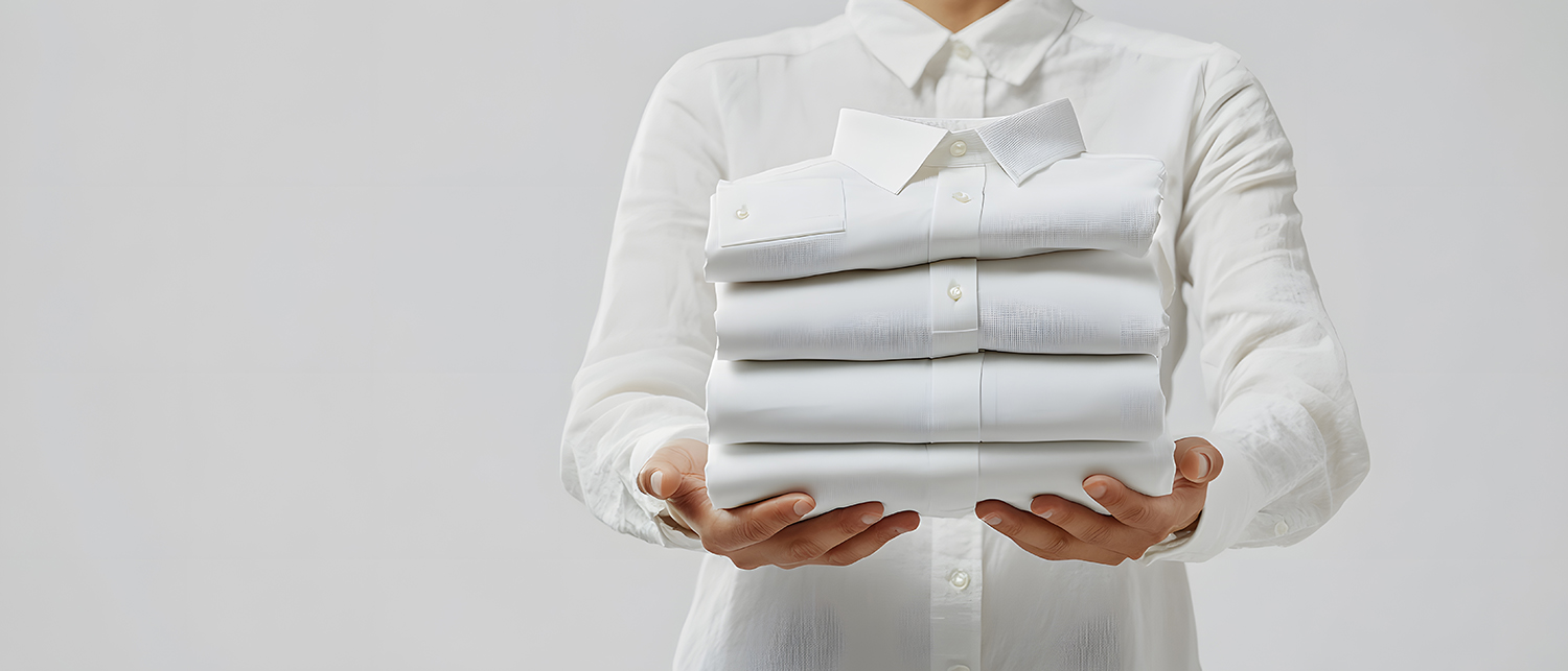 person-holding-folded-blue-shirts.jpg